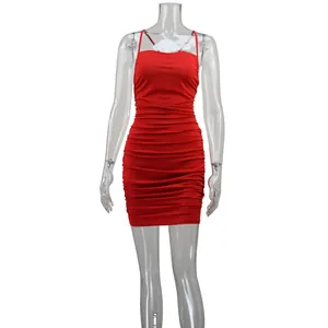 Detail view of a red ruched bodycon mini dress with spaghetti straps on clear mannequin