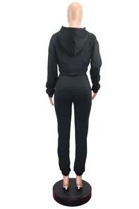 Back view of black two-piece tracksuit set featuring hooded sweatshirt and joggers