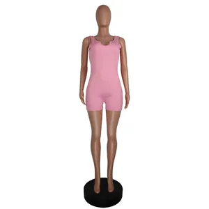 Detailed shot of a pink ribbed U-neck sleeveless bodycon romper jumpsuit on a mannequin