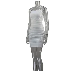 Detailed view of a white ruched bodycon mini dress displayed on a clear mannequin.