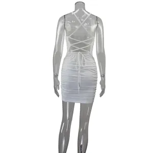 Back view of white ruched bodycon mini dress with sexy crisscross lace-up straps