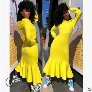 Front and back view of a yellow long-sleeved hooded mermaid dress for women