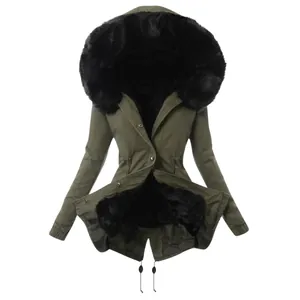 Detailed view of women's olive green winter parka coat with oversized black faux fur hood