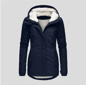 Detail view of navy blue women's parka showing the thick white sherpa fleece hood
