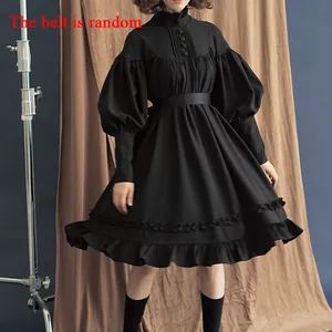 Elegant black Japanese Lolita dress with lantern sleeves and ruffled decorative buttons.