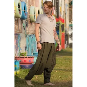 Men's loose harem pants with ethnic print and tapered ankle in olive green cotton