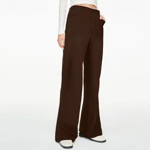 Detailed view of dark brown high-waisted wide-leg trousers for a casual chic look