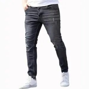 Jeans skinny in denim elasticizzato grigio scuro da uomo con dettagli strappati e usurati
