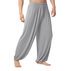 Comfortable men's loose light grey yoga pants with elastic waist and gathered ankles
