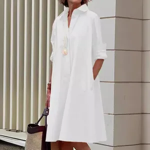 Elegant minimalist white loose shirt dress with long sleeves and collar for women