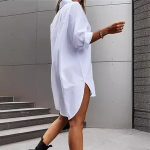 Oversized white cotton linen shirt dress with side slits and curved hem for women