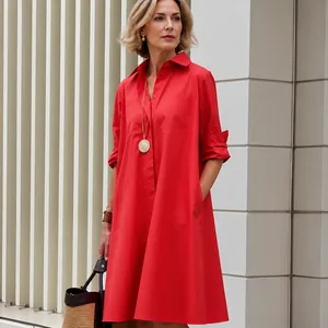 Elegant red long-sleeved loose shirt dress with lapel collar and A-line silhouette.