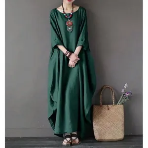 Κομψό oversized πράσινο λινό φόρεμα για γυναίκες με στρογγυλή λαιμόκοψη και boho στυλ.
