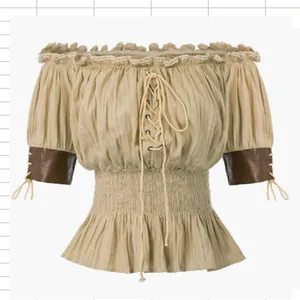 Detailed view of medieval Renaissance blouse with smocked waist and lace-up front design.