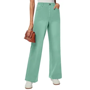 Fashionable mint green high-waisted straight leg stretch denim pants worn by a model