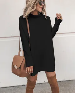 Cozy black long sleeve mock neck knit sweater dress styled with tall brown boots