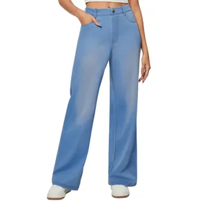 Close-up view of high-waisted light blue straight-leg denim jeans with button detail