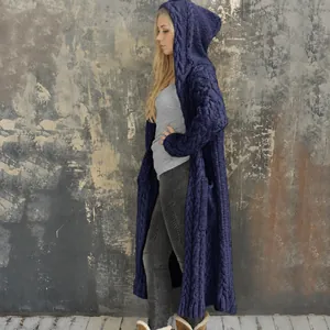 Side view detail of a navy blue cable knit hooded long cardigan sweater with pockets