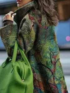 Close-up detail of women's vintage floral print wool coat showing premium fabric texture.