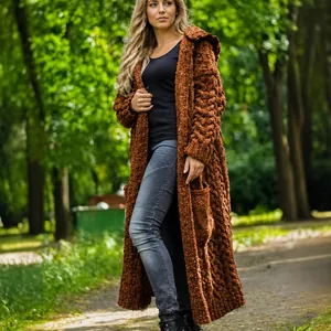 Women's cozy long hooded cable knit cardigan sweater in rust khaki color outdoor