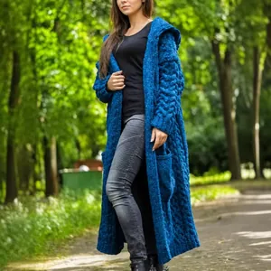 Stylish women's royal blue hooded cable knit long cardigan sweater in chunky knit