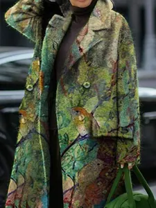 Detailed close-up of artistic bird and nature print on a fuzzy green wool blend coat.