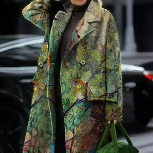 Stylish women's long wool coat with artistic bird and foliage print in a street setting.
