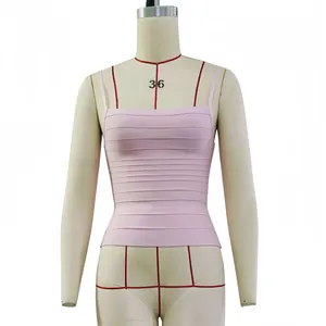 Detail shot of a light pink square neck bandage camisole featuring a ribbed texture