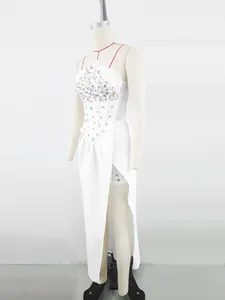 Detail view of white strapless evening dress with rhinestone bodice and high slit