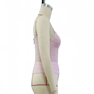 Side view detail of a light pink bandage camisole featuring textured horizontal stripes.