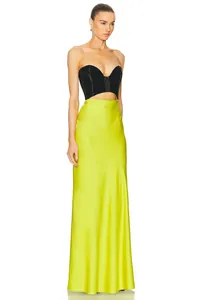 Elegant strapless color-block dress with black bustier and lime green satin skirt detail view.
