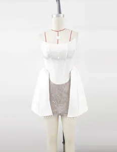 Detailed view of white bandage corset with pearl accents and delicate lace overlay.