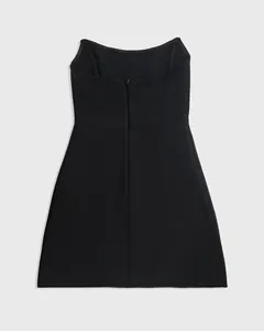 Detailed back view of a black A-line bandage party dress featuring a central zipper closure