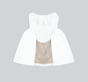 Elegant white bandage mini dress with pearl beads and intricate lace panel details