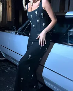 Detailed shot of luxury black square neck bandage dress with crystal snowflake embellishments