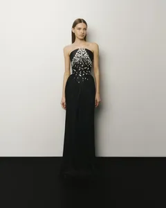 Full-body view showing the elegant silhouette and intricate silver rhinestone detailing