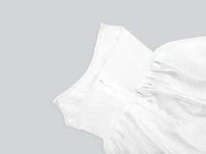 Detail view of a white satin bandage dress showing the hidden back zipper and stitching