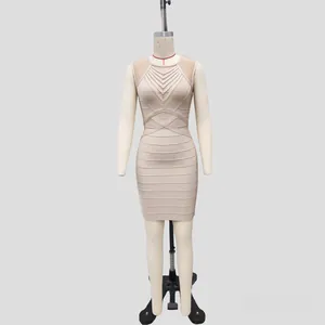 Detailed view of a elegant champagne bandage dress with mesh paneling and v-neck