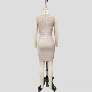 Detailed back view of a beige bandage bodycon dress featuring mesh stitching and long zipper