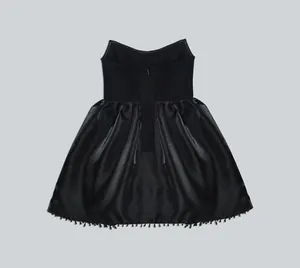 Elegant back view of a black strapless bandage party dress with a beaded fringe hemline