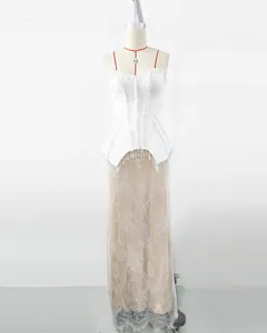 Elegant white evening dress with crystal fringe corset and lace maxi skirt detail