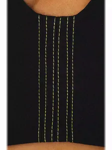 Detailed close-up of a black tube top dress featuring vibrant neon yellow contrast stitching