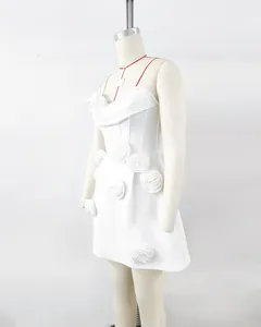 Detail view of elegant white 3D flower strapless bandage party dress on mannequin