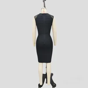 Elegant black bodycon bandage dress with mesh shoulder panels back view.
