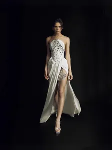 Elegant white strapless evening dress with rhinestone bodice and high slit for party.