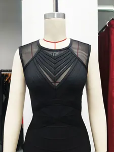 Close-up detail of an elegant black bandage dress with mesh patchwork and chevron straps