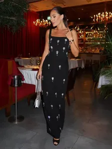 Elegant black sleeveless square neck maxi dress with sparkling starburst rhinestone patterns