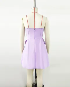 Back view of lavender strapless bandage dress featuring invisible zipper and floral detail