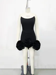 Front view of black bandage mini dress featuring three large ruffled 3D flower appliques.