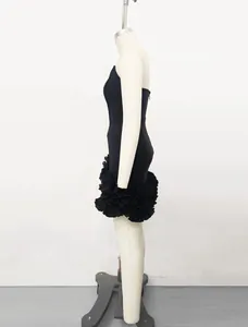 Side profile of a black bandage mini dress with tiered floral ruffles on a mannequin.